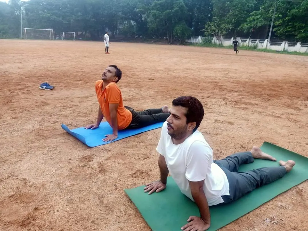 Clients in cobra pose on mats
